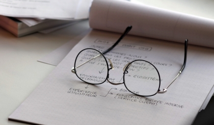 Glasses on the paper notebook - concept of education